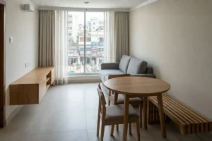 Small living room interior with a slim-depth sofa and a wall-mounted floating TV cabinet to maximize floor space.